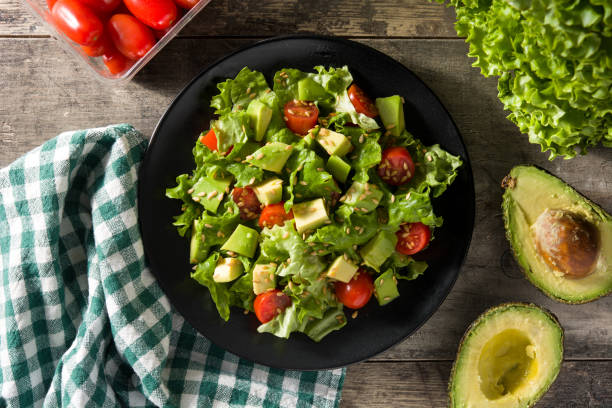 istock Salad with avocado, lettuce, tomato and flax seeds 1199706758