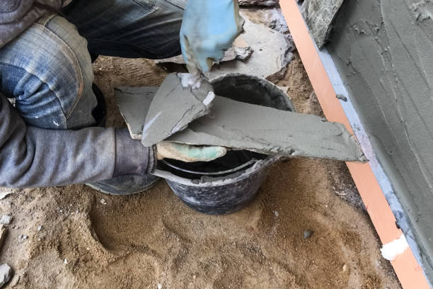 istock builder faces the basement of a house with a wild stone. Flat for cladding, tabata on the construction site. 1199707299