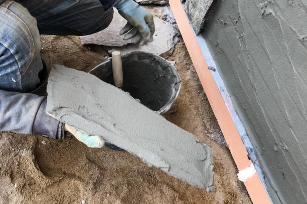 istock builder faces the basement of a house with a wild stone. Flat fo 1199707322