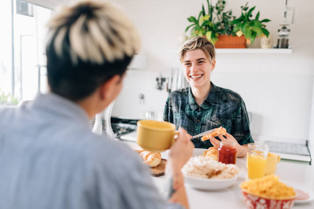 istock Lesbian Couple Eating Breakfast 1199708259