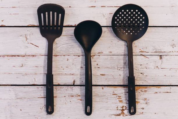 istock kitchen utensils on white wooden background 1199708532