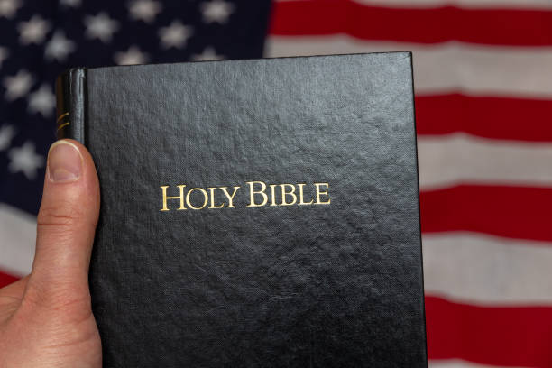 istock hand holding holy bible 1199709337