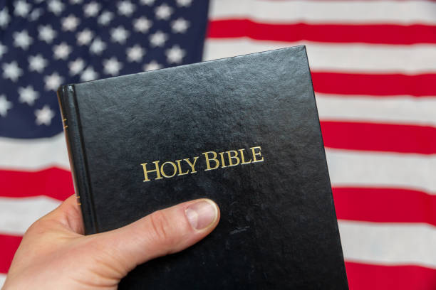 istock hand holding holy bible 1199709619