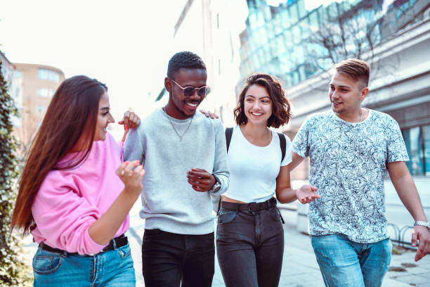 istock Friends Taking A Walk Together Downtown 1199715156