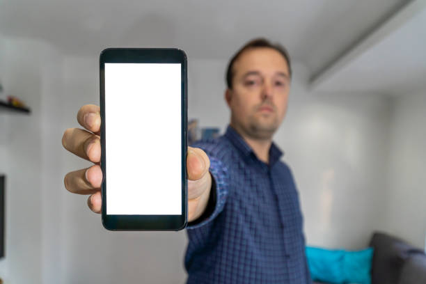 istock Person showing a phone with empty screen 1199716597
