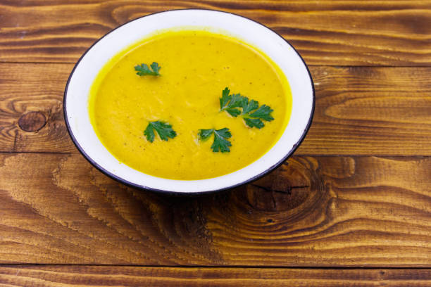 istock Pumpkin soup on a wooden table 1199717552