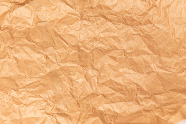 istock Crumpled Brown Paper Background close up 1199718460