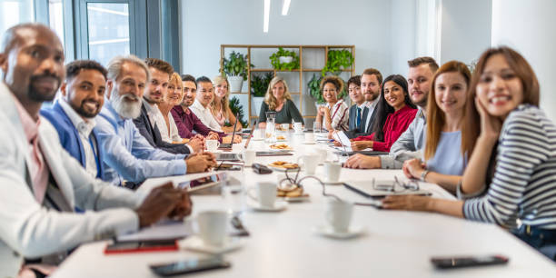 istock Business team sitting at a conference table 1199718533