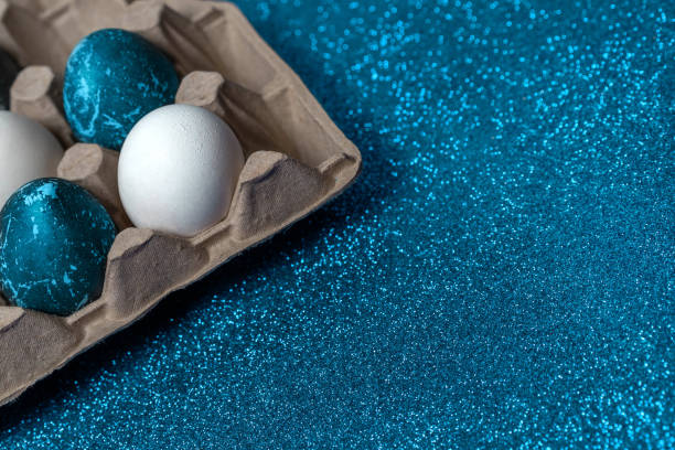 istock Creatively painted chicken Easter eggs with natural hibiscus dye, look like blue stones. 1199718719