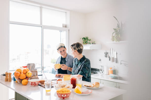 istock Lesbian couple making plans on laptop during breakfast 1199718926