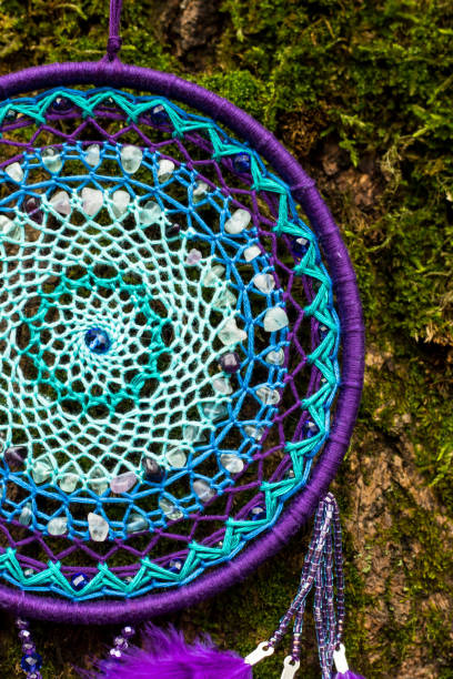 istock Handmade dream catcher with feathers threads and beads rope hanging 1199719262