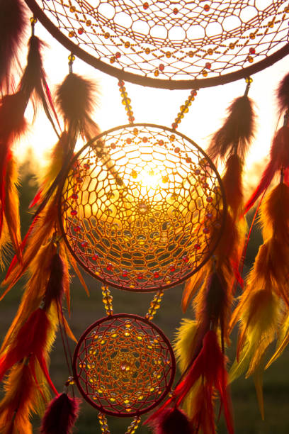 istock Handmade dream catcher with feathers threads and beads rope hanging 1199719348