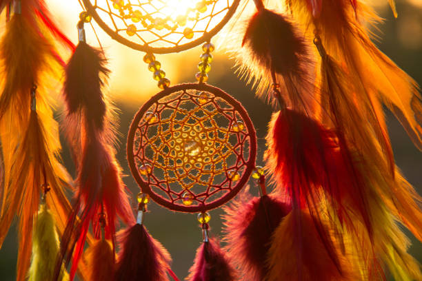 istock Handmade dream catcher with feathers threads and beads rope hanging 1199719349