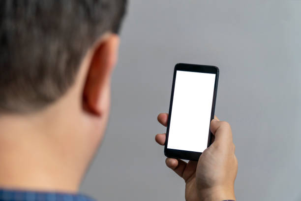 Back head view of empty smartphone screen stock photo