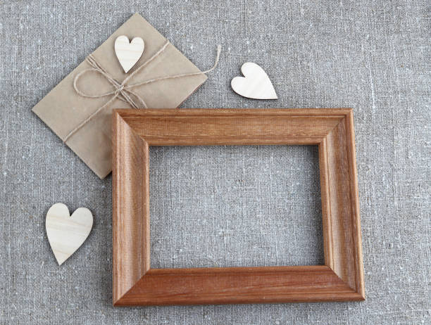 istock Paper envelope wooden frame hearts 1199720653