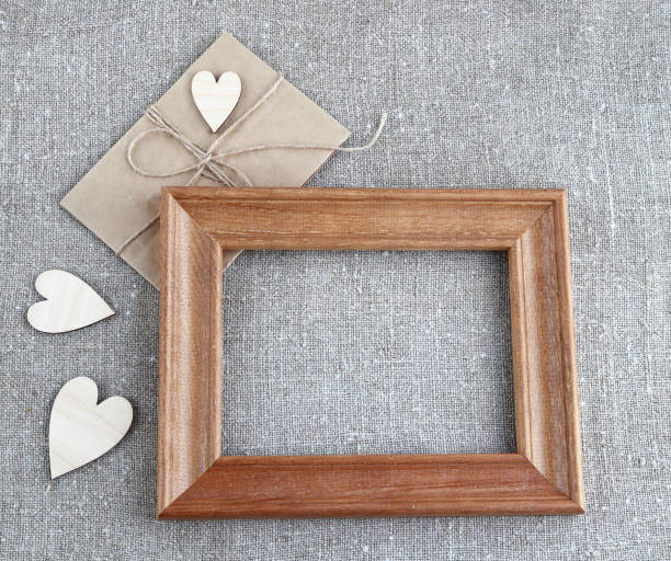 istock Paper envelope wooden frame hearts 1199720662