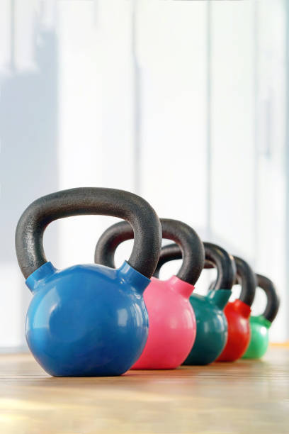 istock Colorful kettlebells in gym 1199723623