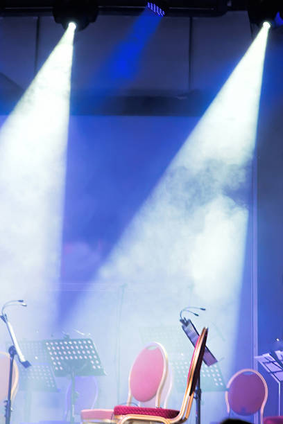 istock Spotlights and laser beams. Concert light. Stage lights 1199729696