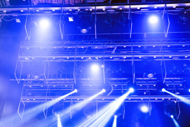 istock Spotlights and laser beams. Concert light. Stage lights. Soffits. 1199729856