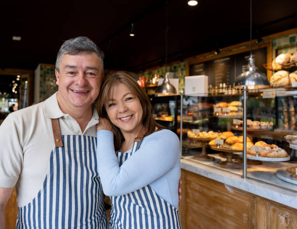 istock Happy team of waiters working at a cafe 1199731371