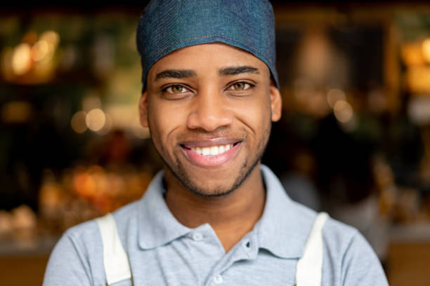 istock Happy African American cook working at a restaurant 1199731440