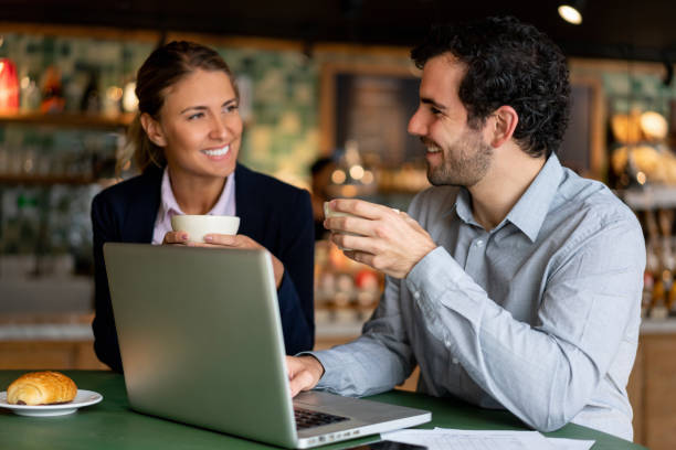 istock Business people working online at a coffee shop 1199731453
