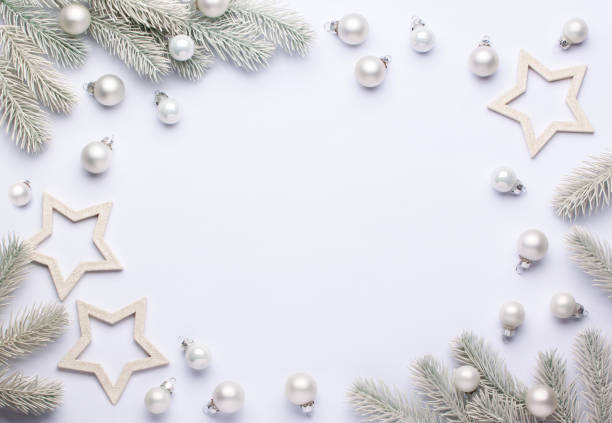 istock Light composition with white Christmas balls and spruce branches. 1199733822