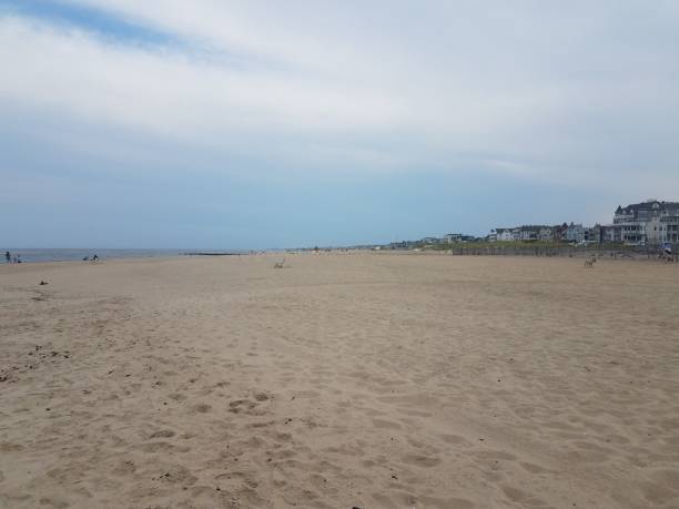 istock ocean water at coast or shore with sand and buildings 1199733852
