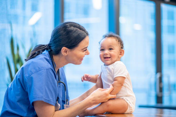 istock Nurse Practitioner Checking out a Young Baby stock photo 1199735103