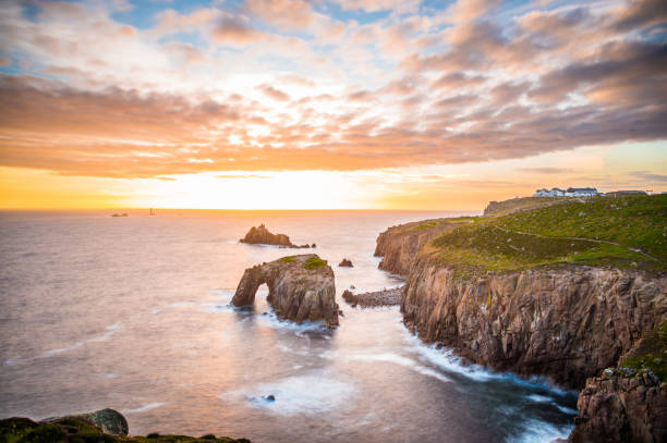 istock Dramatic sky at sunset with Enys Dodnan and the Armed Knight rock formations 1199735290