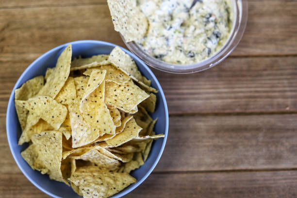 istock A bowl of Chia seed tortilla chips with spinach dip on the side 1199736709
