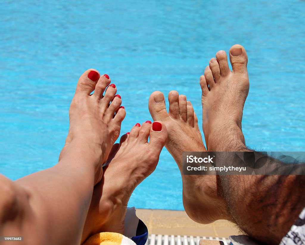 Maschio e femmina piedi - Foto stock royalty-free di Pedicure
