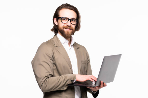 istock Business man holding a laptop isolated over a white background 1199738660