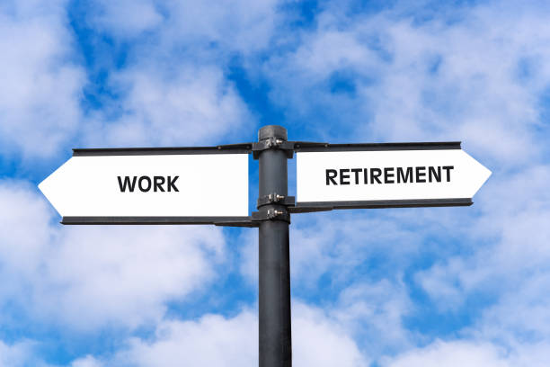 Choice between keep working and retirement stock photo