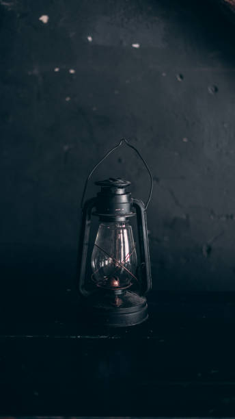 istock black old kerosene lamp on a black background 1199740522