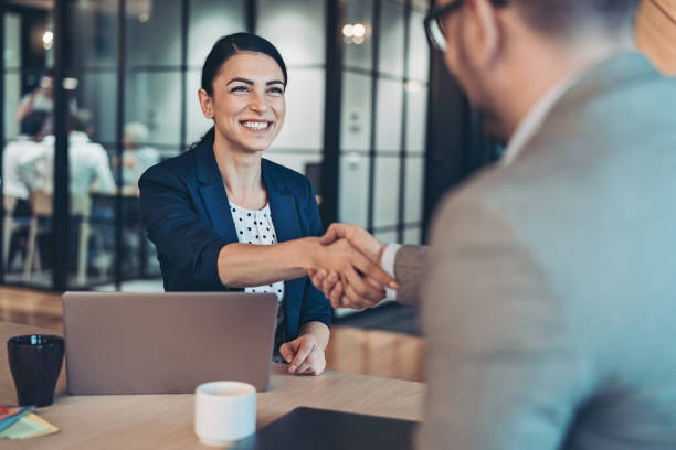 Handshake for the new agreement Business persons talking in the office partnership stock pictures, royalty-free photos & images