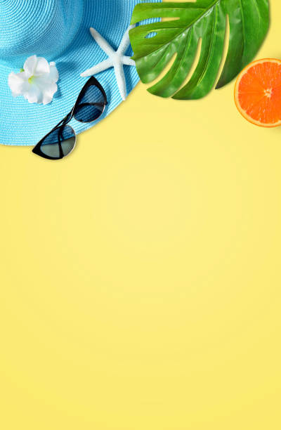 istock Tropical Summer Beach Background. Palm Trees Branches, hat with starfish on yellow summer background. Travel. Summer concept. 1199742528