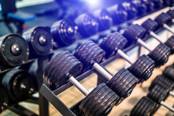 istock Rows of dumbbells in the gym with blurred background. 1199743782