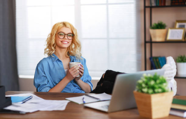 istock happy young   business woman at home office working on computer 1199744925
