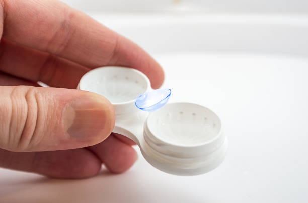istock the man is holding a container for soft contact lenses and a lens 1199746572