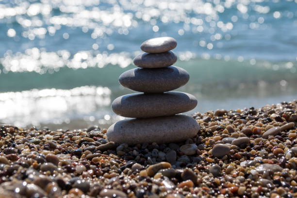 istock Stones and pebbles stack, harmony and balance, one stone cairn on seacoast 1199747329