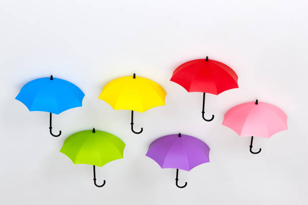 Row of colorful umbrellas on white background