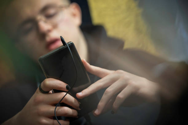 istock a teenager using smartphone at home 1199747495