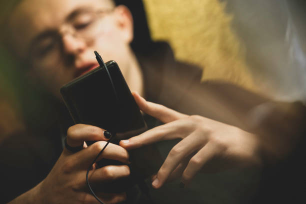 istock a teenager using smartphone at home 1199747503