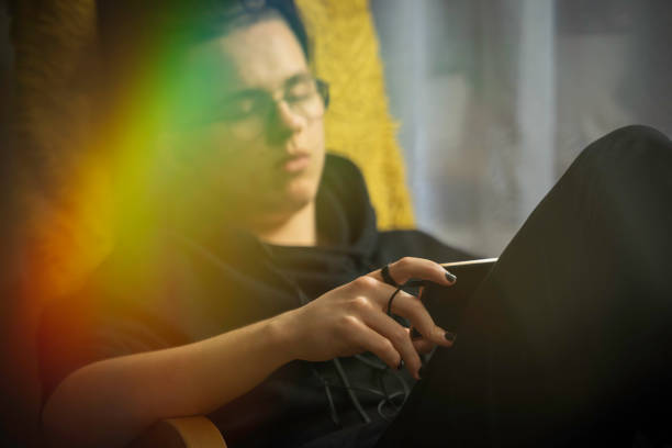 istock a teenager using smartphone at home 1199747506