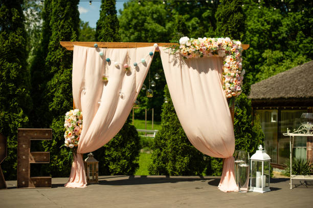 istock Wedding arch decoration with flowers on summer sunny day 1199747518