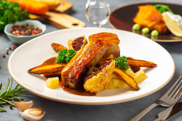 istock Pork trio - slow roasted bacon, glazed ribs, black pudding in panko 1199747636