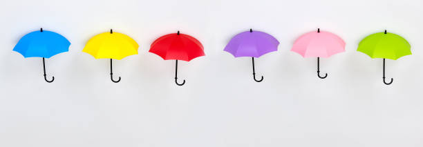 Row of colorful umbrellas on white background