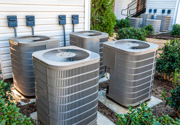 Apartment Air Conditioners REWORKED Horizontal shot of four apartment air conditioners outside. air conditioner photos stock pictures, royalty-free photos & images