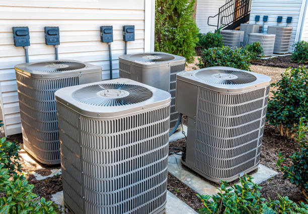 Apartment Air Conditioners REWORKED Horizontal shot of four apartment air conditioners outside. condenser stock pictures, royalty-free photos & images